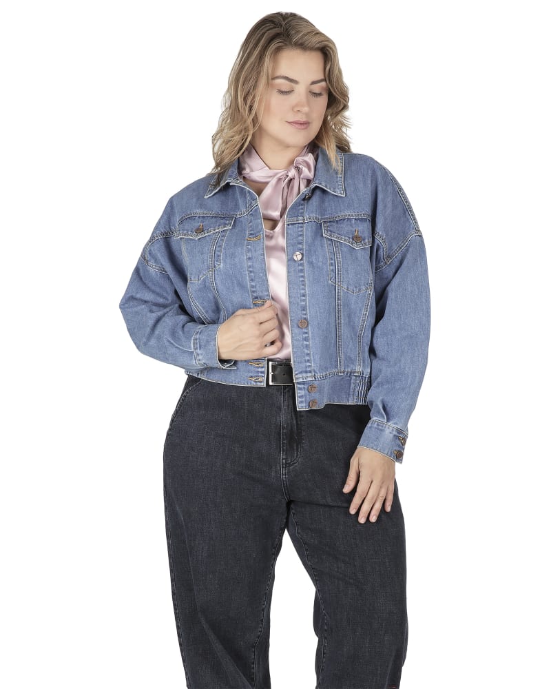 Front of a model wearing a size 1X Women's Button Front Drop Down Shoulder Cropped Denim Jacket in Stone Wash by Standards & Practices. | dia_product_style_image_id:276346